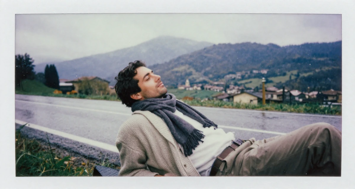 A relaxed and observant male From Florence Italy, majored in sculpture arts in their 47, solo traveler exploring the world in luxury, wearing a cozy knit cardigan and slacks, wrapping a scarf around the neck in a country road.