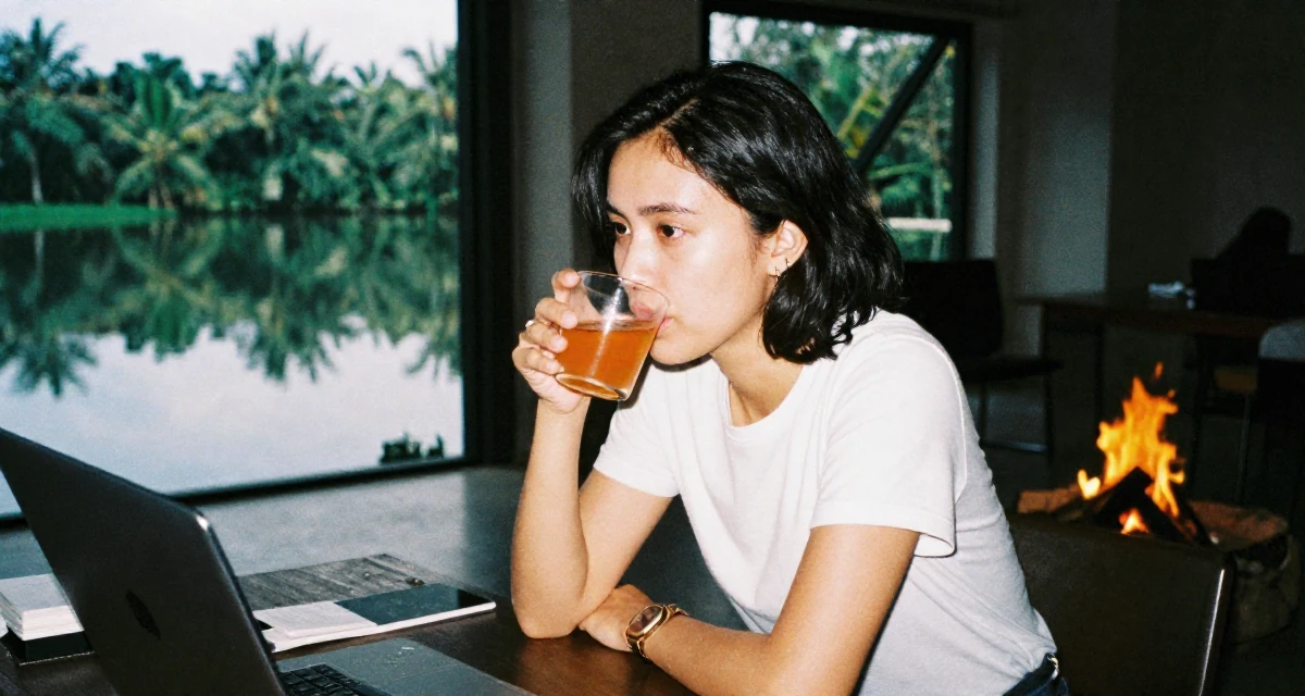 A tranquil Female From Indonesia, based in Bali, graduated from an arts institute majoring in expressive digital portraits in their 22, feeling imposter syndrome in office meetings, wearing a minimalist everyday clothing, sipping a warm drink in a industrial loft.