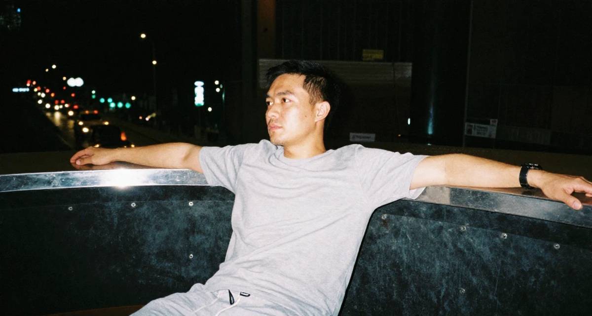 A contemplative male From Bangkok Thailand, studied tourism management in their 34, advocating for eco-friendly parenting, wearing a comfortable lounge wear set, stretching arms in a concert hall.