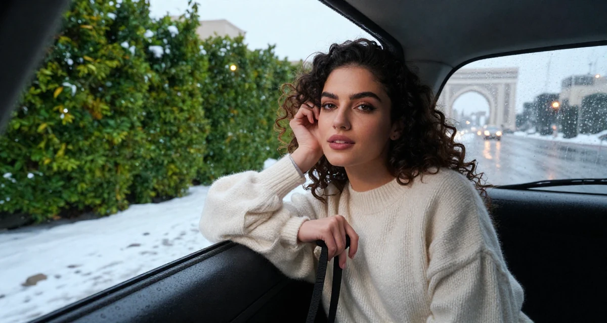 A self-assured Female From Abu Dhabi UAE, learned studio production and lighting design in their 23, discovering how makeup transforms flirty confidence, wearing a soft cashmere sweater look, holding a leash in a snowy sidewalk.
