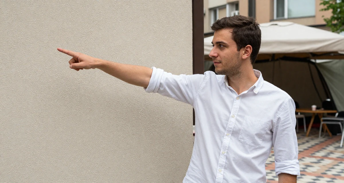 A gentle male From Sofia Bulgaria, studied alternative creative media in their 26, learning to endure hate comments quietly, wearing a crisp button-up with rolled sleeves, pointing at something distant in a camping site.