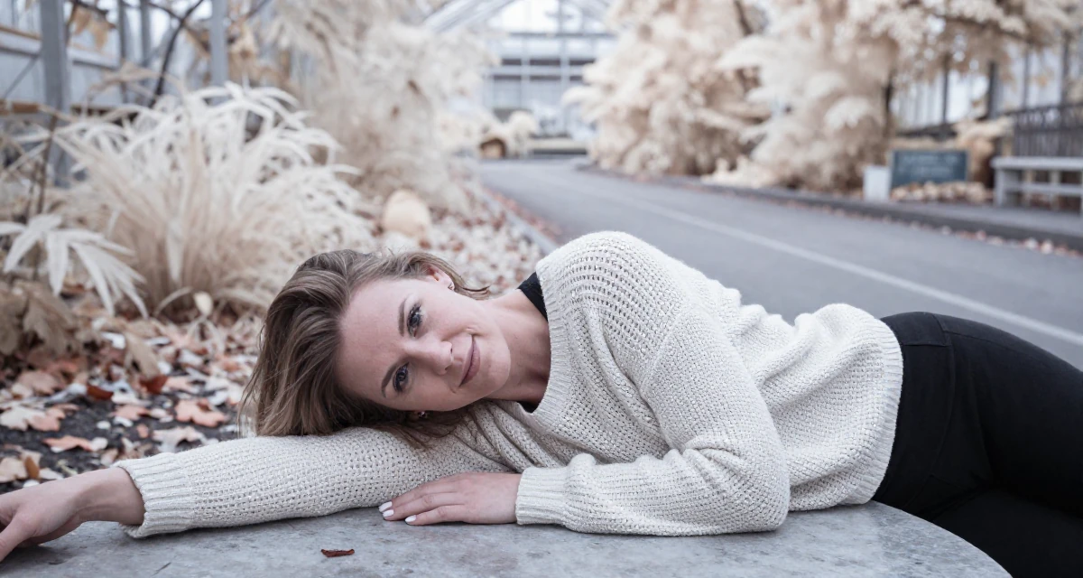A gentle and kind Female From Aarhus Denmark, trained in fitness coaching and body alignment in their 40, re-evaluating life goals with clarity, wearing a loose open-knit sweater showing skin underneath, resting hands on a table in a botanical greenhouse.