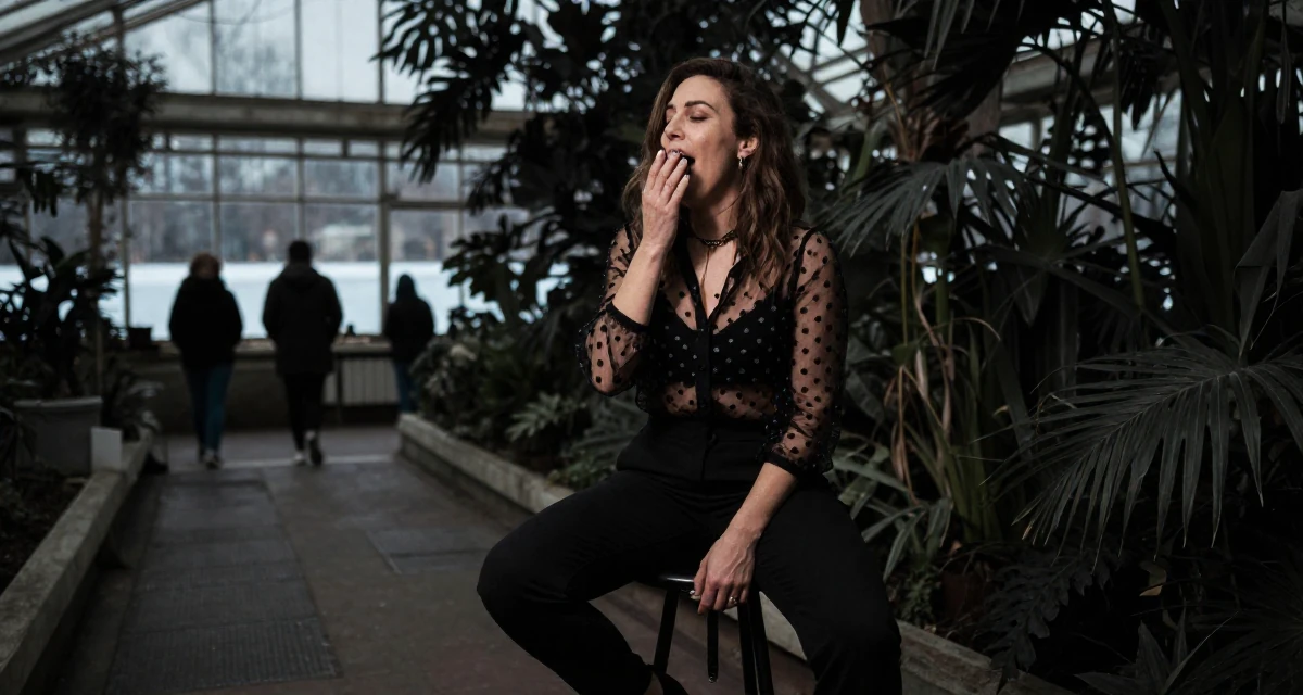 A pleased Female From Greece, studied philology in their 40, fit and active lifestyle advocate, wearing a sheer polka dot blouse and black trousers, yawning discreetly in a botanical greenhouse.