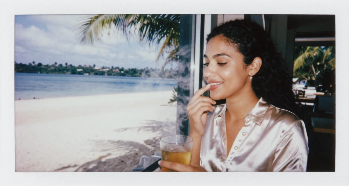 A captivating Female From Johannesburg South Africa, explored fitness lifestyle content in their 25, smiling gently with a secret inner peace, wearing a satin blouse with pearl buttons, checking a reflection in a window in a tropical white sand beach.